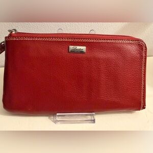 Buxton RFID L-Zip expandable wallet with a removable strap.